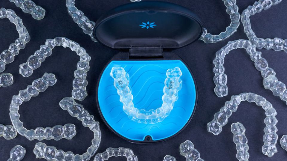 Invisalign Clear Braces in a Blue & Black Retainer Case