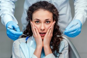 A Woman Having a Fear of Dentist